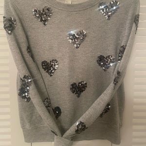 Long sleeved cotton/polyester blend with ribbed collar and waistline.